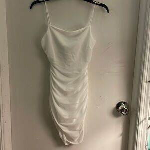 Brand new never worn!! Slim fit white dress VERY flattering
